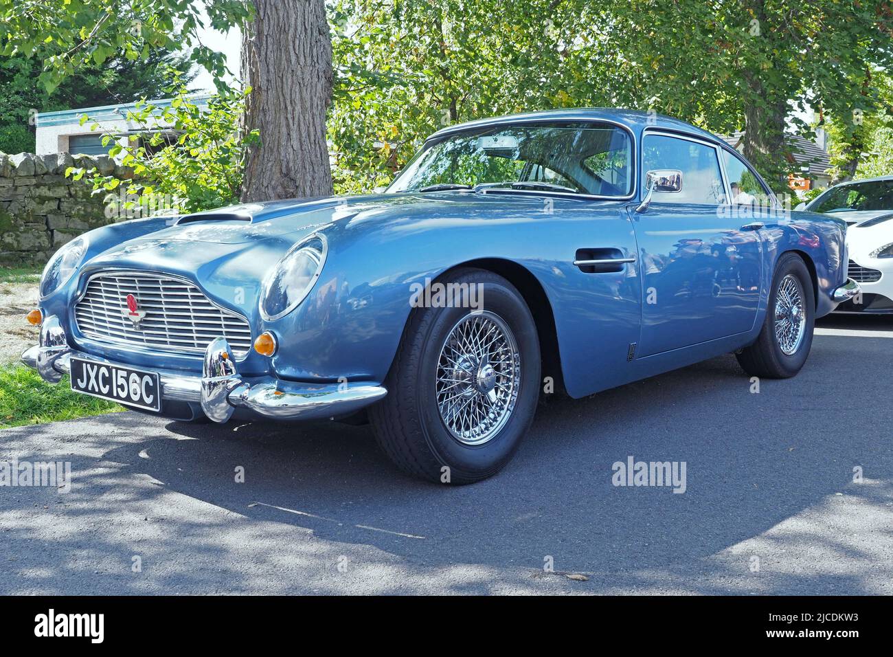 Aston Martin DB5, 4lt straight six, made in 1965, in `Caribbean Pearl` blue metallic, with wire wheels. Made famous by the James Bond movies. Stock Photo